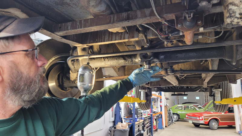 You ream the bushings until the pin "just" goes through with minimal drag. Careful, it's easy to overdo it, and then you're screwed.