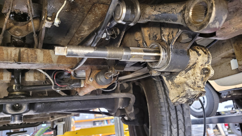 Reaming the steering box bushings.