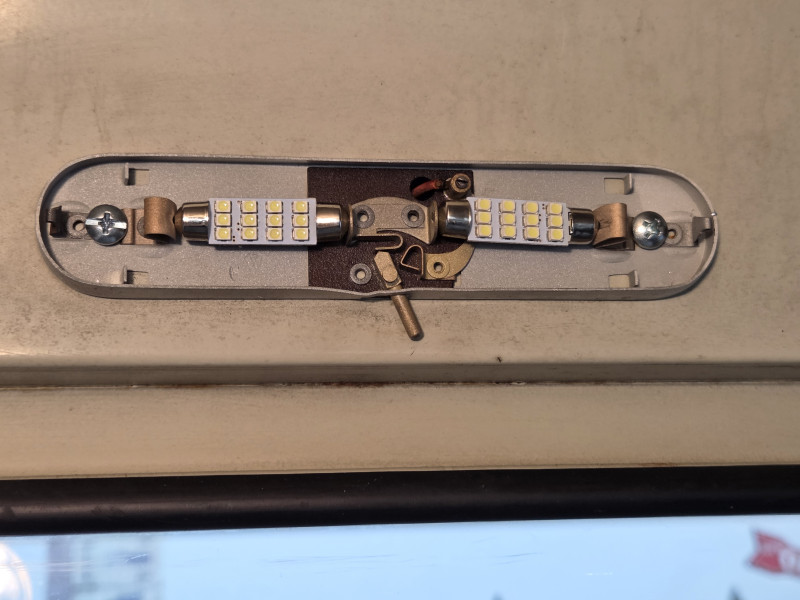 I removed and bead blasted the dome light housing, lubed the switch, installed LED bulbs and mounted it with new screws. These LEDs are also polarity sensitive, so if you reverse them they do not light. They draw .17a which is more than I thought they would. It would be fine to forget them overnight but math shows they would take over 500 hours to run the battery dead.