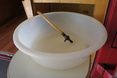 Close Up of Sink Bowl with Hose and "Faucet"