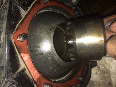 Sometimes the axle carrier comes out with the axle. Others you have to wiggle out by hand.