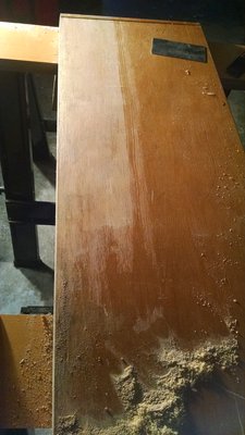 You can see the difference in color. With the clear coat and natural wood.